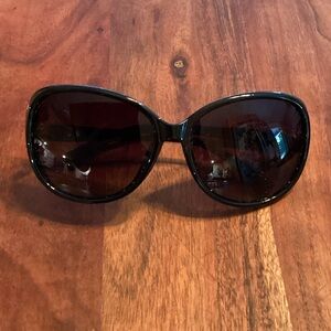 Stylish Black Sunglasses with cat detailing.